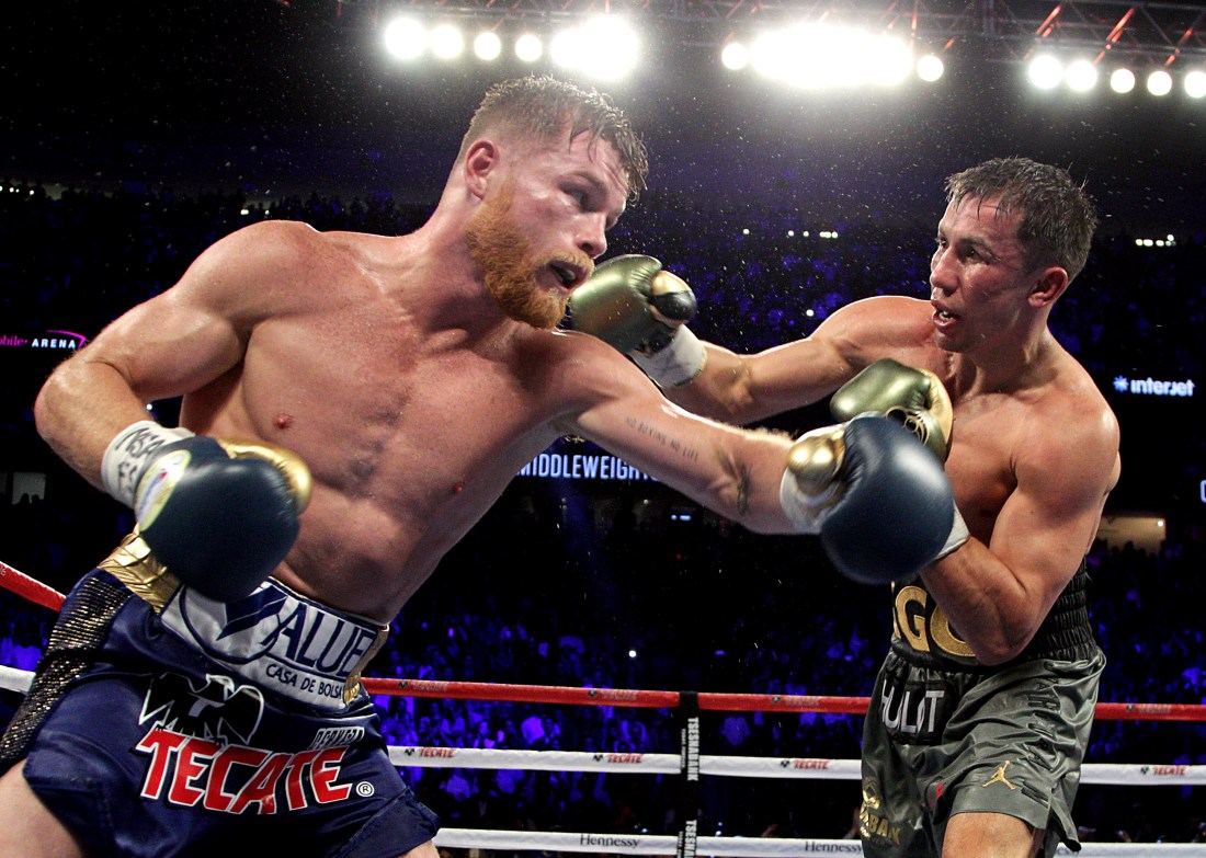 Boxing: Golovkin retains titles in thrilling draw with Alvarez